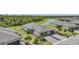 Aerial view of home with lush landscaping, neutral tones, and paver driveway at 2232 Bonito Way, Port Charlotte, FL 33953