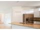 Modern kitchen with stainless steel appliances, granite countertops, and white cabinetry at 2232 Bonito Way, Port Charlotte, FL 33953