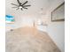 Spacious living room with a large ceiling fan and tile floors, perfect for entertaining guests at 2232 Bonito Way, Port Charlotte, FL 33953