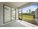 Screened-in lanai with brick flooring and views of the backyard at 2232 Bonito Way, Port Charlotte, FL 33953