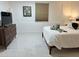 Cozy bedroom with natural light and modern decor at 23442 Harper Ave, Punta Gorda, FL 33980