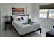 Cozy bedroom with natural light and modern decor at 23442 Harper Ave, Punta Gorda, FL 33980