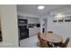 Updated kitchen features gray cabinets and modern black appliances at 23442 Harper Ave, Punta Gorda, FL 33980