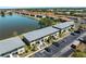 Aerial view showcases the property's proximity to a serene lake at 25225 Rampart Blvd # 205, Punta Gorda, FL 33983