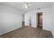 Bright bedroom features a ceiling fan, wood-look floors, an ensuite bathroom, and spacious closet at 25225 Rampart Blvd # 205, Punta Gorda, FL 33983