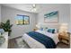 Cozy bedroom with a comfy bed, stylish decor, and a window overlooking lush greenery at 25225 Rampart Blvd # 205, Punta Gorda, FL 33983