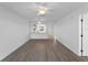 Open living space with a view to the kitchen featuring modern flooring and neutral paint at 25225 Rampart Blvd # 205, Punta Gorda, FL 33983