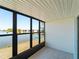 This enclosed sunroom offers tile floors and water views at 25225 Rampart Blvd # 205, Punta Gorda, FL 33983
