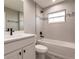 Bathroom showcasing a bathtub, white vanity, and matching toilet at 27260 Porto Nacional Dr, Punta Gorda, FL 33983