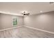 Spacious bedroom features hardwood floors, a ceiling fan, recessed lights, and a large window with blinds at 27260 Porto Nacional Dr, Punta Gorda, FL 33983