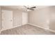 Light and airy bedroom featuring a ceiling fan and wood-look flooring at 27260 Porto Nacional Dr, Punta Gorda, FL 33983