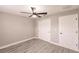 Bedroom features modern ceiling fan, light gray walls, and wood-look flooring at 27260 Porto Nacional Dr, Punta Gorda, FL 33983