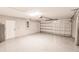 A spacious garage with epoxy flooring and a garage door, with room for vehicle parking at 27260 Porto Nacional Dr, Punta Gorda, FL 33983