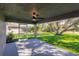 A screened patio with view of lawn and landscaping, offering a relaxing outdoor space at 27260 Porto Nacional Dr, Punta Gorda, FL 33983