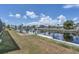 Backyard featuring a canal view with a seating area for relaxing and enjoying waterfront scenery at 280 Belvedere Ct, Punta Gorda, FL 33950