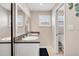 Elegant bathroom with double vanity, dual mirrors, and a separate toilet room, offering convenience and style at 280 Belvedere Ct, Punta Gorda, FL 33950