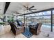 Expansive screened patio with multiple seating areas, pool, and canal views, designed for ultimate outdoor enjoyment at 280 Belvedere Ct, Punta Gorda, FL 33950