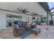 Inviting covered patio featuring comfortable wicker seating, ceiling fans, and stylish decor for outdoor relaxation at 280 Belvedere Ct, Punta Gorda, FL 33950