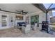Inviting patio with outdoor dining and a grill, ideal for entertaining and enjoying waterfront views at 280 Belvedere Ct, Punta Gorda, FL 33950