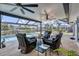 Spacious screened patio with a pool and canal view, perfect for outdoor relaxation and entertainment at 280 Belvedere Ct, Punta Gorda, FL 33950