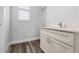 Modern bathroom featuring a vanity with quartz countertop and a large window at 3297 Swanee Rd, Punta Gorda, FL 33980