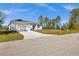 Charming single-story home features a two-car garage, a well-manicured lawn, and a concrete driveway at 3297 Swanee Rd, Punta Gorda, FL 33980