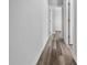 Bright hallway with luxury vinyl plank floors, neutral walls, and white trim throughout at 3297 Swanee Rd, Punta Gorda, FL 33980
