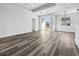 Open-concept living room featuring luxury vinyl plank flooring, neutral paint colors, and bright natural light at 3297 Swanee Rd, Punta Gorda, FL 33980