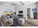 Staged living room showcasing luxury vinyl plank flooring, bright natural light, and modern furnishings at 3297 Swanee Rd, Punta Gorda, FL 33980