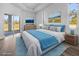 Staged bedroom offering sleek floors, a bed, and lots of natural light from the outdoor access at 3297 Swanee Rd, Punta Gorda, FL 33980