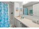 Clean bathroom with a shower and decorated with tropical-themed accessories for a cohesive look at 3310 Loveland Blvd # 1906, Punta Gorda, FL 33980