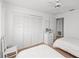 Well-lit bedroom featuring twin beds, closet, and a classic dresser for storage at 3310 Loveland Blvd # 1906, Punta Gorda, FL 33980