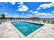 Sparkling community pool surrounded by ample seating and lush landscaping at 3310 Loveland Blvd # 1906, Punta Gorda, FL 33980