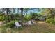 Cozy backyard seating area with a small table and chairs, perfect for relaxing and enjoying the outdoors at 3357 Vassar St, Port Charlotte, FL 33980