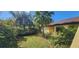 This backyard features lush vegetation at 3357 Vassar St, Port Charlotte, FL 33980