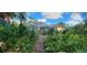 The property features a screened-in porch and lush greenery, providing a private outdoor area at 3357 Vassar St, Port Charlotte, FL 33980