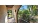 Welcoming screened entrance with tile floor and view of lush landscaping at 3357 Vassar St, Port Charlotte, FL 33980