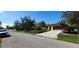 Charming single-story home with a two-car garage, complemented by mature landscaping and a spacious driveway at 3357 Vassar St, Port Charlotte, FL 33980