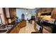 Cozy kitchen with tile flooring, wood cabinets, stone backsplash, and ample counter space at 3357 Vassar St, Port Charlotte, FL 33980