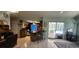 Open living area with tile flooring and a sliding door to the pool area, perfect for entertaining guests at 3357 Vassar St, Port Charlotte, FL 33980