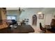 Open floor plan featuring a living room, kitchen, and adjacent study area at 3357 Vassar St, Port Charlotte, FL 33980