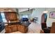 Open-concept living area with tiled flooring, vaulted ceilings, and modern furnishings for a comfortable living experience at 3357 Vassar St, Port Charlotte, FL 33980