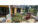 A beautifully decorated backyard patio that includes a grill, flowers and chairs at 3357 Vassar St, Port Charlotte, FL 33980