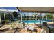 Inviting screened-in pool with spacious patio area, perfect for entertaining or relaxation at 3357 Vassar St, Port Charlotte, FL 33980