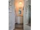 Cozy bathroom featuring nautical decorations and white cabinets for a relaxing atmosphere at 354 Blackburn Blvd, North Port, FL 34287