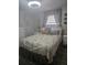Comfortable bedroom with seashell accents, soft lighting, and coordinated decor creating a serene retreat at 354 Blackburn Blvd, North Port, FL 34287