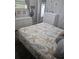 Charming bedroom with seaside theme, featuring wicker dressers and starfish patterned quilt at 354 Blackburn Blvd, North Port, FL 34287