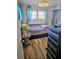 Cozy bedroom featuring a comfortable bed, stylish dresser, and serene decor for a restful retreat at 354 Blackburn Blvd, North Port, FL 34287