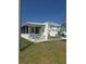 Delightful single-story home featuring a screened-in porch and beach-themed accents at 354 Blackburn Blvd, North Port, FL 34287