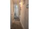 A long hallway with several doorways and beach themed decorations at 354 Blackburn Blvd, North Port, FL 34287
